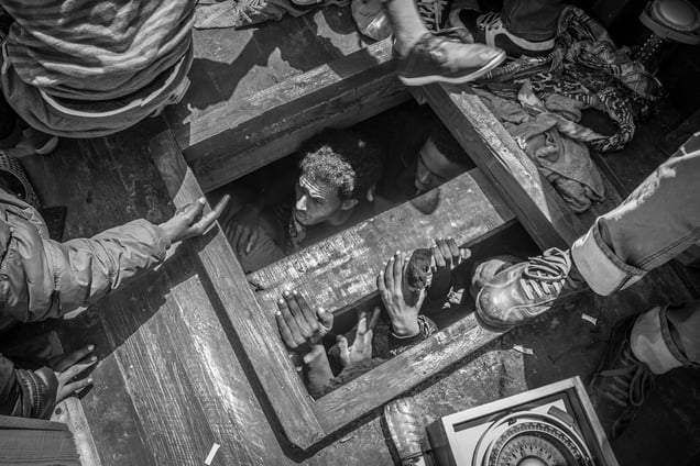 Eritrean  refugees packed under the deck of a boat carrying 561men women and children