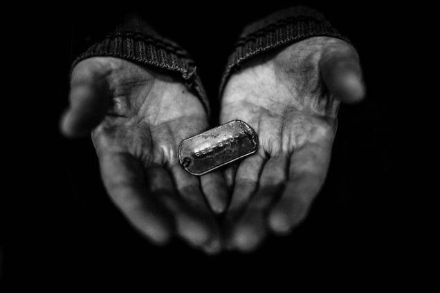 Eshrat Tabatabayee (72), the mother of Ahmad Afshar, embraces her son's body after 30 years of waiting. He was identified by his ID tag