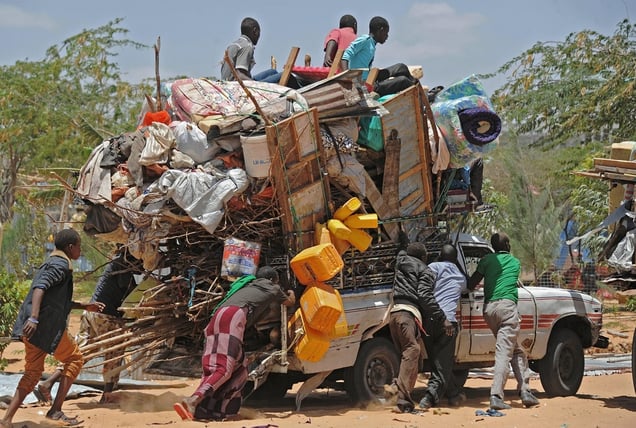 Somali refugees whose makeshift shelters were amongst the dozens of houses and shops destroyed by soldiers acting on orders from the Somali government. Sarkusta refugee camp, southern Mogadishu, March 4, 2015. © Mohamed Abdiwahab / AFP