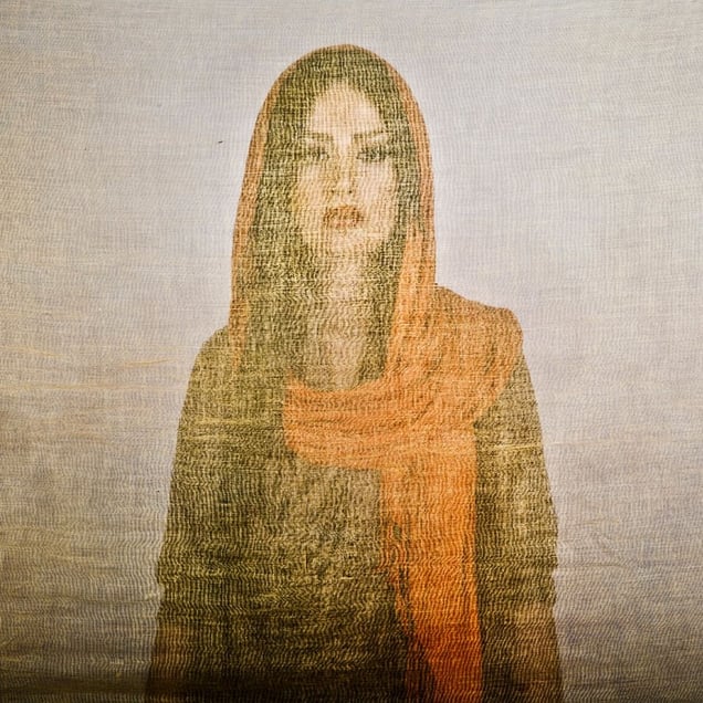 Nazanin, an Iranian woman is photographed through the fabric of her hijab (the Islamic headscarf worn by women in the presence adult men who are not members of her immediate family). Since the Islamic revolution in 1979, Iranian women are not allowed to be seen in public without proper Islamic head dress in Iran. Not wearing a proper hijab is illegal and can result in arrest by a special police un