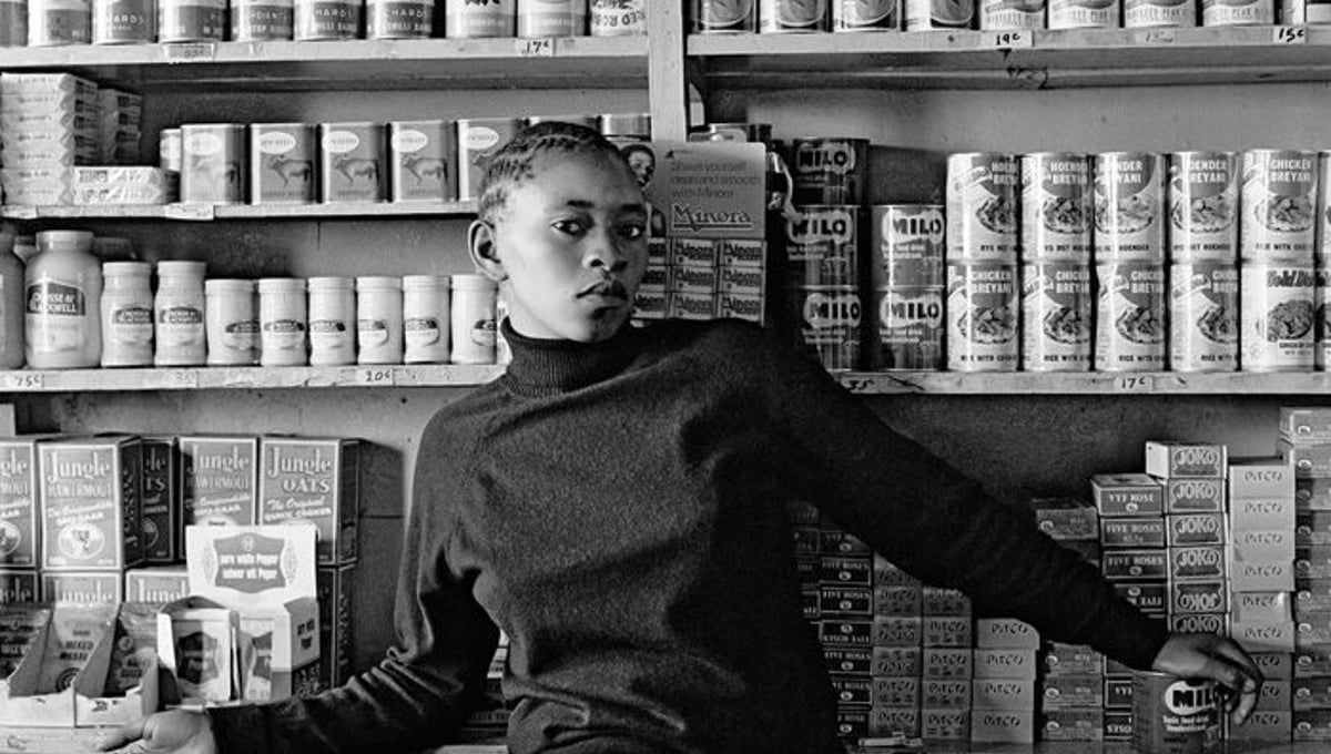 Shop assistant, Orlando West. 1972 © David Goldblatt