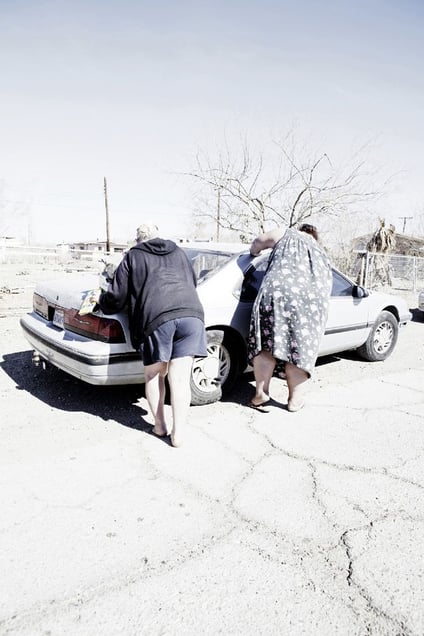 Women washing their car.