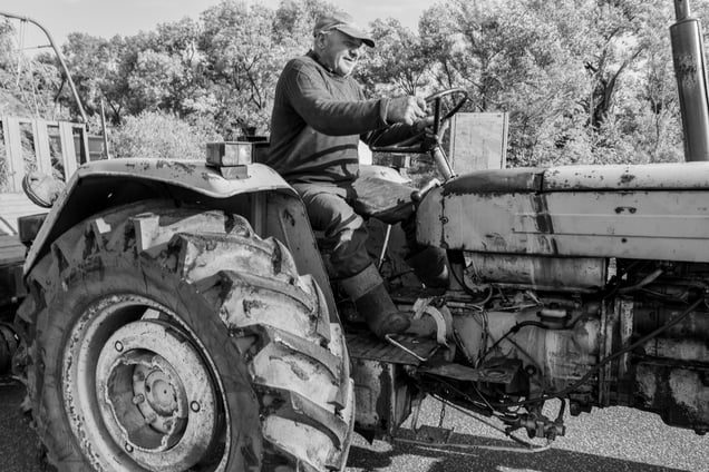 Farmer coming back home after a hard day's work.