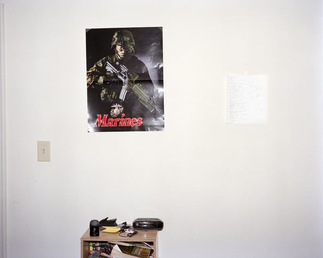 Sharrod's bedroom (Marines poster). From the series "I slowly watched him disappear" © Jason Hanasik