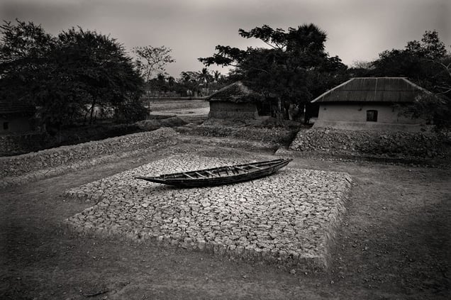 A boat sits idle on a patch of land barren and cracked from salinity. Gabura, Satkhira. © Munem Wasif/VU'
