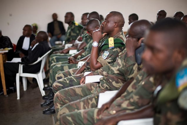 All but four of the 37 soldiers accused of rape sat in the trial room. The missing four were still on active duty in northern DRC. Twenty-five of the accused were lower-ranked soldiers, and 12 were officers in charge of those soldiers’ units. At a trial in nearby Mupoke in 2013, only one soldier stood accused of rape. The others fled before the trial took place. © Diana Zeyneb Alhindawi