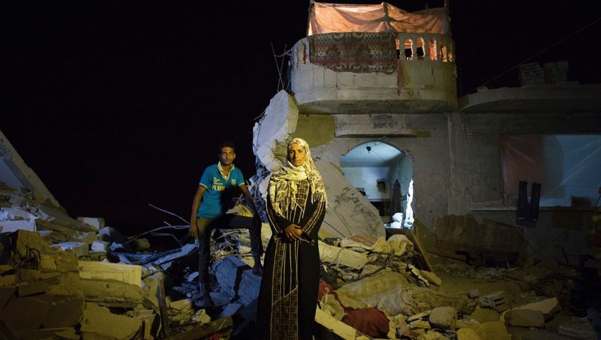 Safia Mohamed Al-Najar, 47, and her 25 year old son Fadi Al-Najar saw their home in Khan Yunis destroyed by airstrike during the 2014 summer's 50-day war. Despite the dangerous condition, they have to stay, since there is no place else for them to move, or too expensive to do so. And virtually no body has come to help them yet. The son was supposed to marry soon, but it was canceled.