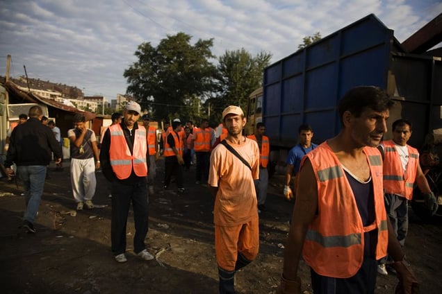 The first city workers, many of them Roma themselves, arrive at the Nova Gazela settlement at 7am on August 31, 2009 to help with the relocation and destruction of the camps. © Matt Lutton