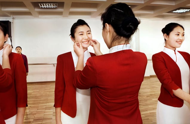 Wang Xue is smiling at the Olympic School for volunteers in Beijing. – Why do you think they chose you to present medals at the Olympics? “I have a nice figure, the right height, I’m slim and smart. And I love to smile. I’ll be the smiling face that represents China to the world.