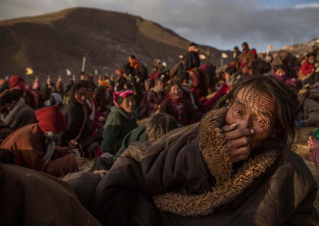 Tibetan Buddhist nomads listen during the annual Bliss Dharma Assembly in Sertar county, Garze Tibetan Autonomous Prefecture, Sichuan province, China, 31 October 2015.