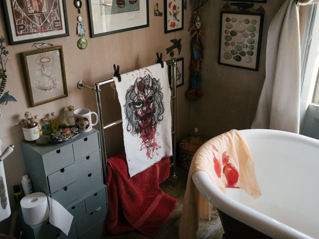 Lois's drawing and dress with blood stains, in Carey's bath