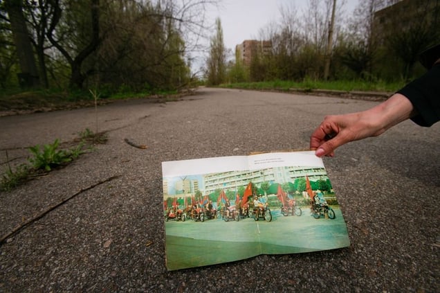 Pripyat, Ukraine 2005. A photo of the same street years earlier. "Radiation: it scares people and it scares animals. And birds. And the trees are scared, too, but they’re quiet." —Anna Badaeva