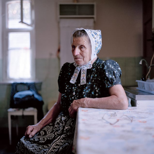 Emma Krahl (b. 1931) in her  Sunday dress for church, Schleife Area, Lusatia, Germany 2010. From the series: Village Queens. The last women in their traditional peasant garbs