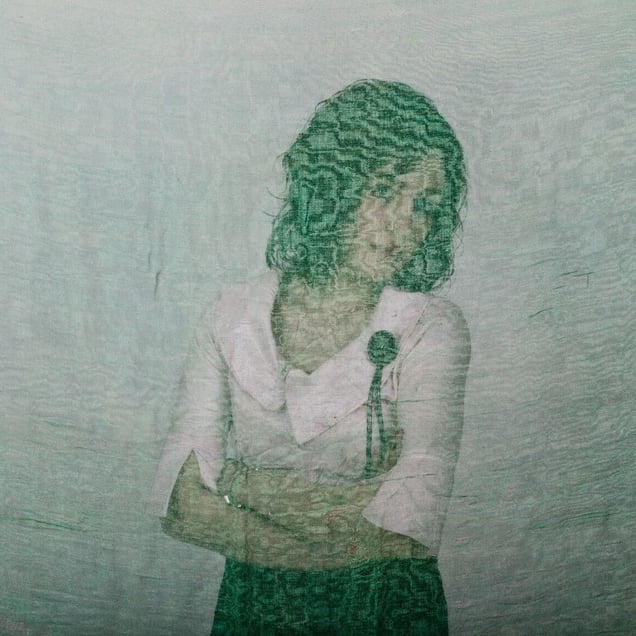 Mina, an Iranian woman is photographed through the fabric of her hijab (the Islamic headscarf worn by women in the presence adult men who are not members of her immediate family). Since the Islamic revolution in 1979, Iranian women are not allowed to be seen in public without proper Islamic head dress in Iran. Not wearing a proper hijab is illegal and can result in arrest by a special police unit,