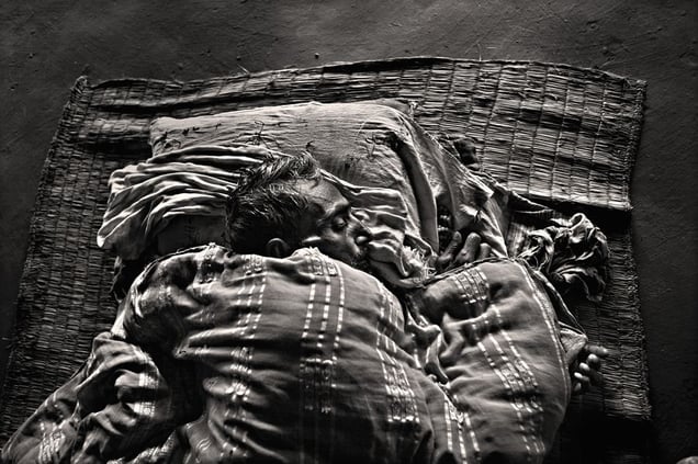 High salinity levels in the water have affected health. Amer Chan (60) is suffering from liver cancer. He is resting on a jute mat in his clay hut. Patrakhola, Satkhira. © Munem Wasif/VU'