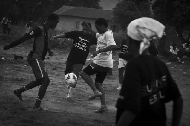 Erison Turây plays in a practice match with female members of the EbolaSurvivors Football Club in the city of Kenema, Sierra Leone, 21 April 2015.