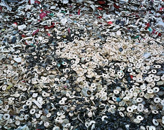 China Recycling #5, Phone Dials, Zeguo, Zhejiang Province, 2004 © Edward Burtynsky