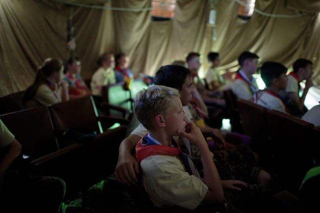 Students escape the heat and watch war films at the Historical-War Camp, in Borodino, Russia. 26 July 2016.