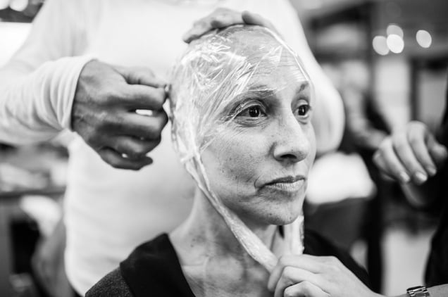 At the Rodolfo Valentin Salon in Manhattan, Laurel Borowick gets fitted for a new wig, as she gave away most of her older wigs from previous cancer diagnosis. New York City, New York. February, 2013 © Nancy Borowick