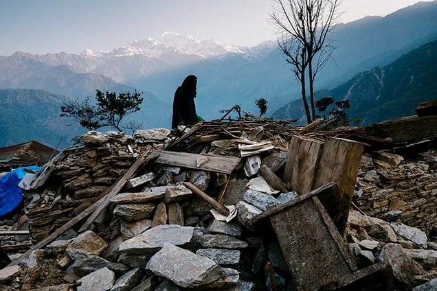 The Bauda Himal mountain watches over the village and blows its breeze.Below, Barpak is a wreck, overwhelmed with stones. Even dust can't hide the confusion on thefaces of Nepalese. Renaud Philippe / Hans Lucas; Renaud Philippe I hanslucas.com