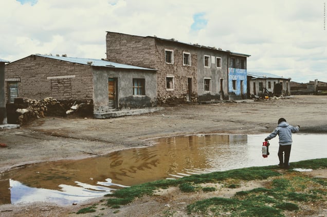 Child playing in the central square of the village of Chipaya