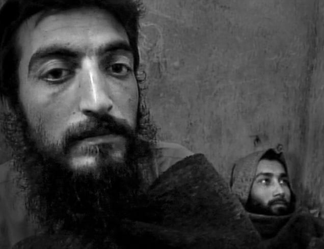 Kabul, Afghanistan (2001). Taleban fighters, caught alive as the Northern Alliance overrun their trenches and took Kabul, await for their fate in prison.