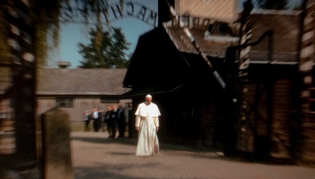 Oswiecim Poland (2016).  Pope Francis walks towards the gate of the former Nazi death camp of Aushwitz.