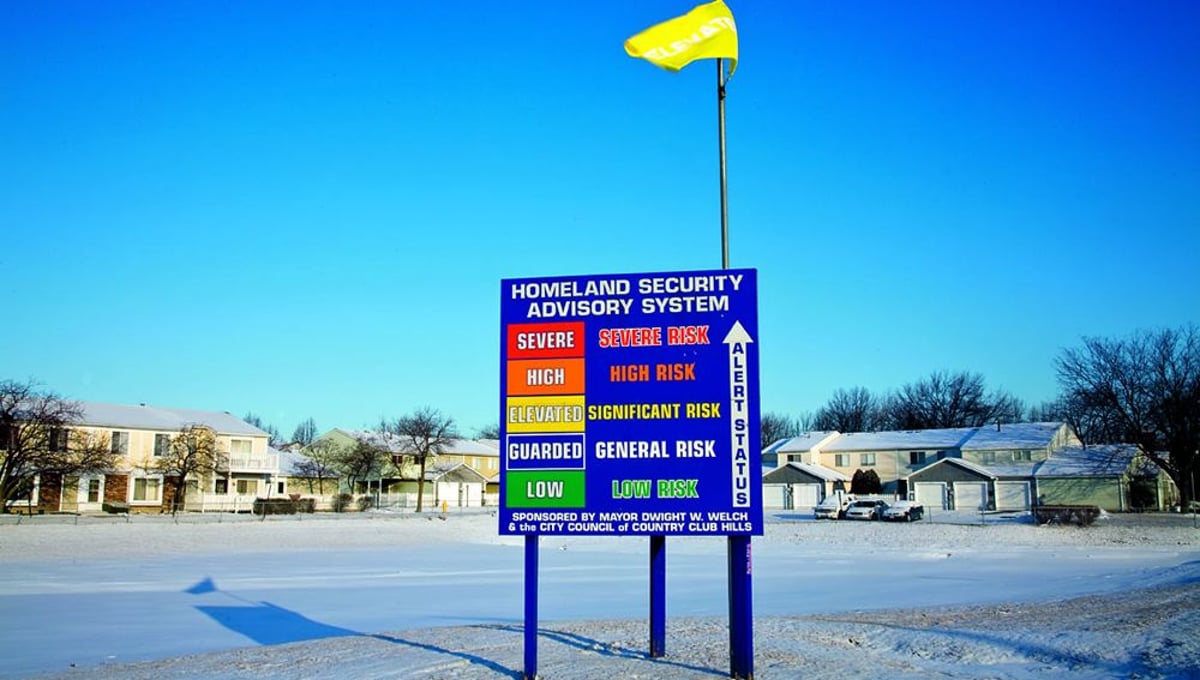 Homeland Security advisory billboard, one of three in the small town of Country Club Hills, Illinois, 2008, from Homeland © Nina Berman