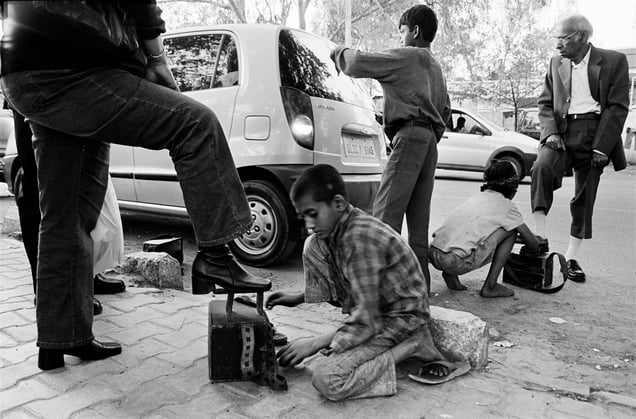 Sagar,9,and Pooja,8, shoe polishers,Delli Haat.