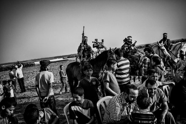 Al-Qassam militiamen pose for the cameras at a celebration to commemorate the Nakba