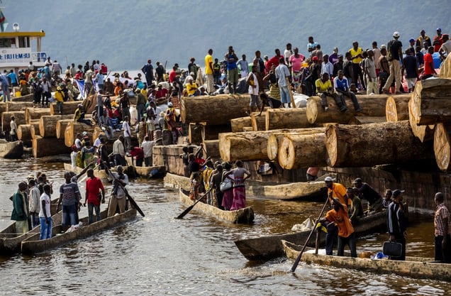 The Congo River at Maluku where a giant barge transporting timber and passengers has just arrived from Kisangani. February, 2013. © Pascal Maitre / Cosmos / National Geographic Magazine