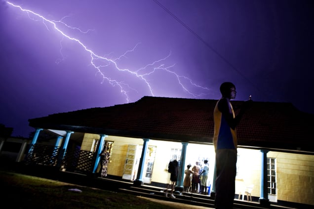 Ivan Wamusi sends a sms to get a safe ride home. A sign outside Mbale Table Tennis Club reads: “Use the power of sport to fight HIV/AIDS!”. In a country struggling with poverty and drug issues, table tennis has become a positive alternative for young Ugandans.