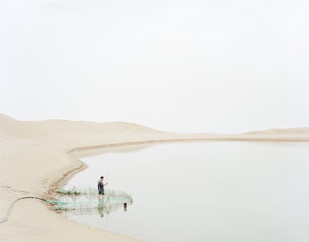 Man Pumping Water in Wasteland, Ningxia Province © Kechun Zhang. Recipient of the Prix découverte