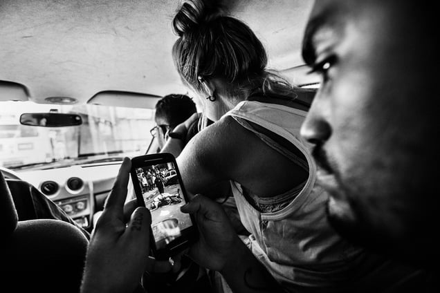 The leader of the Papo Reto collective receives an image of a 22-year-old taxi driver who was shot dead by a police officer; Rio de Janeiro, Brazil, 08 February 2015.