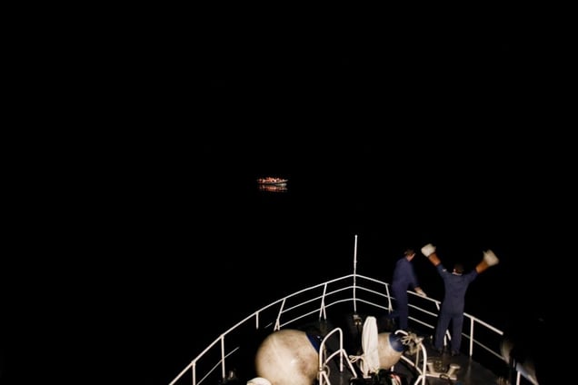 1st prize Contemporary Issues Singles. © Mashid Mohadjerin, Belgium, Reporters/Redux Pictures. Coastguards spot a boat with refugees, off Lampedusa, Italy, 30 July