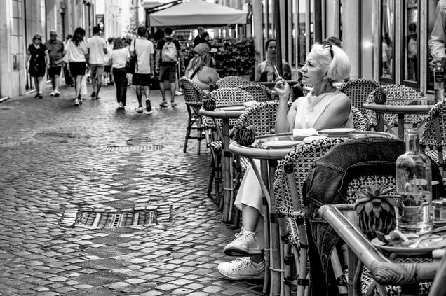 Thoughtful  and solitary white woman in the historic center