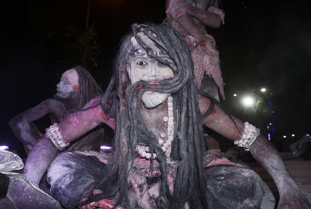 A face smeared in bhasma, reflecting devotion beyond fear of death.