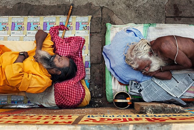 Varanasi, India: Following the completed religious rituals two Sadhus are peacefully sleeping on the shore of the river Ganges in Shiva’s sacred town. © Matjaz Krivic