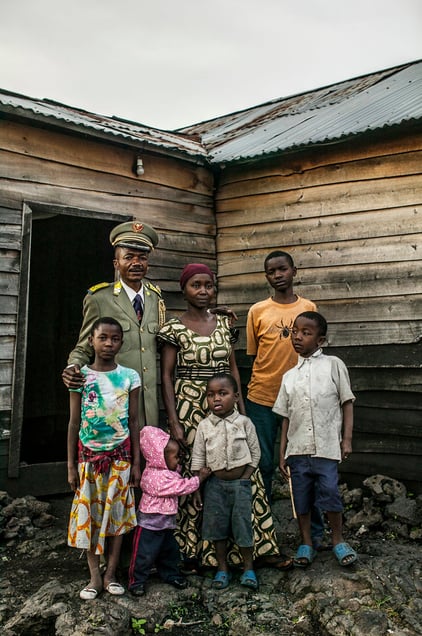 Colonel Aaron Kubuta, the ranking military chaplain in the Congolese national army, stands for a portrait outside his home in the Kitindo military camp in Goma, eastern DR Congo. © Pete Muller / PRIME