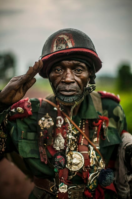 Captain Moro, age 83, stands for a portrait in the village of Munigi, on the outskirts of Goma. Moro entered the so-called "Public Forces" in 1955 under a forced conscription policy of the Belgian colonial authority. © Pete Muller / PRIME