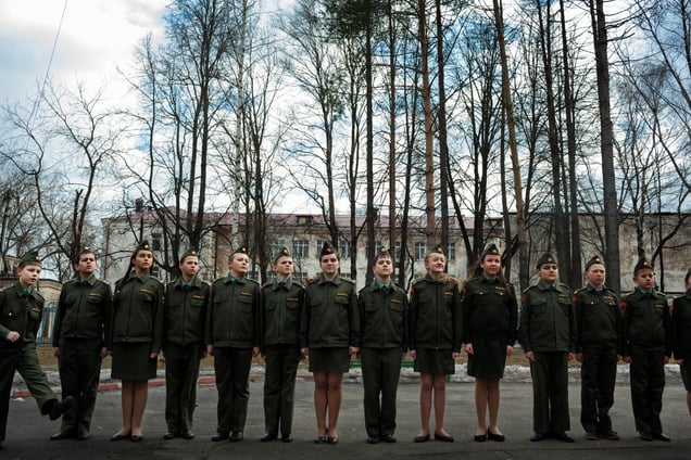 Schoolchildren line up for drill on a Monday afternoon at School #7, 4 Apr 2016, Dmitrov, Russia. Drill is not manditory at School #7, but takes place before classes start at 8:00 and at 15:00. School #7 is a public school but offers cadet classes for those who wish to participate. The benefit of participating in cadet classes includes free lunch, while other students have to pay.