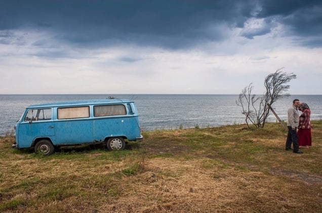 Turkey, TrabzonA couple stand next to a VW Camper van on a cliff overlooking the Black Sea.© Petrut Calinescu