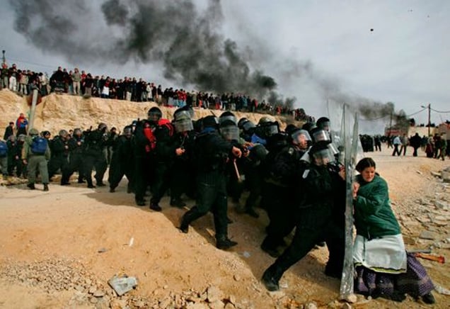 1st prize People in the News Singles, © Oded Balilty, Israel, The Associated Press, Settler woman struggles with Israeli security officer, Amona outpost, West Bank,1 February