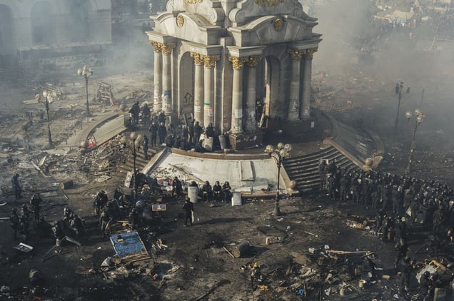 Police and riot police rest on Maidan after clashes in centre Kyiv, 19 Feb. 2014.