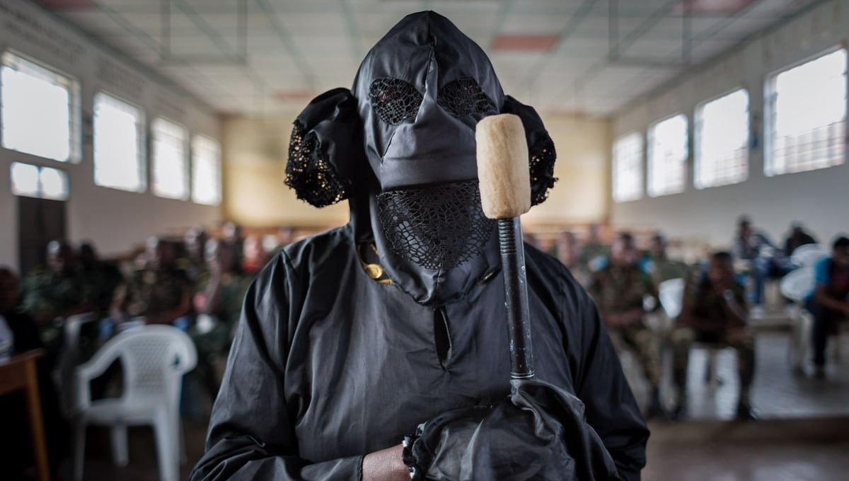 A victim, veiled to protect her identity, testifies. When FARDC soldiers entered her home, her 5 children hid. Her husband was not home. Two soldiers raped her while others carried off goods received from an aid organization: sacks of rice and corn, cans of cooking oil. Her husband returned in the morning. When he learned of the rape, he left and never returned. © Diana Zeyneb Alhindawi