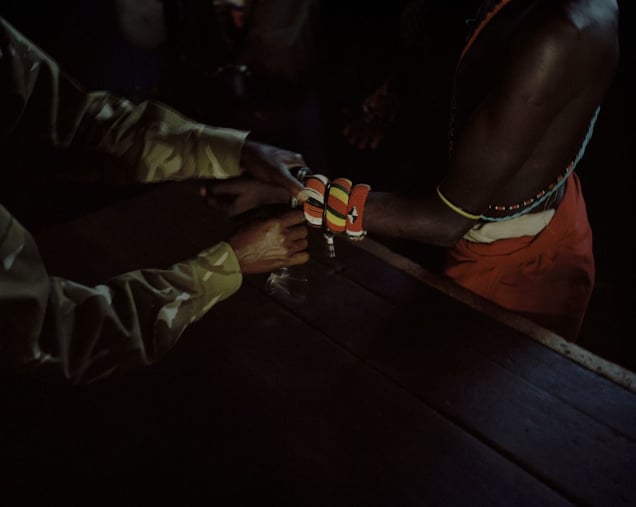 Isiolo Court, northern kenya, a poacher is removed from the cells and handcuffed prior to being taken to court-from the series 'with butterflies and warriors'-David Chancellor