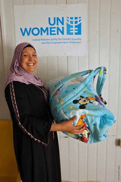 Female operator displays a creation from the sewing workshop
