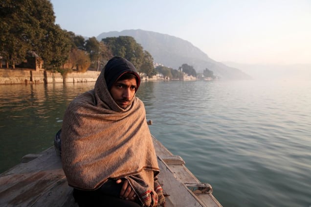 A local man travel to the Kalabagh salt mine by boat, the fastest and easiest way to reach this remote mine located at the edge of Pakistan's tribal belt.