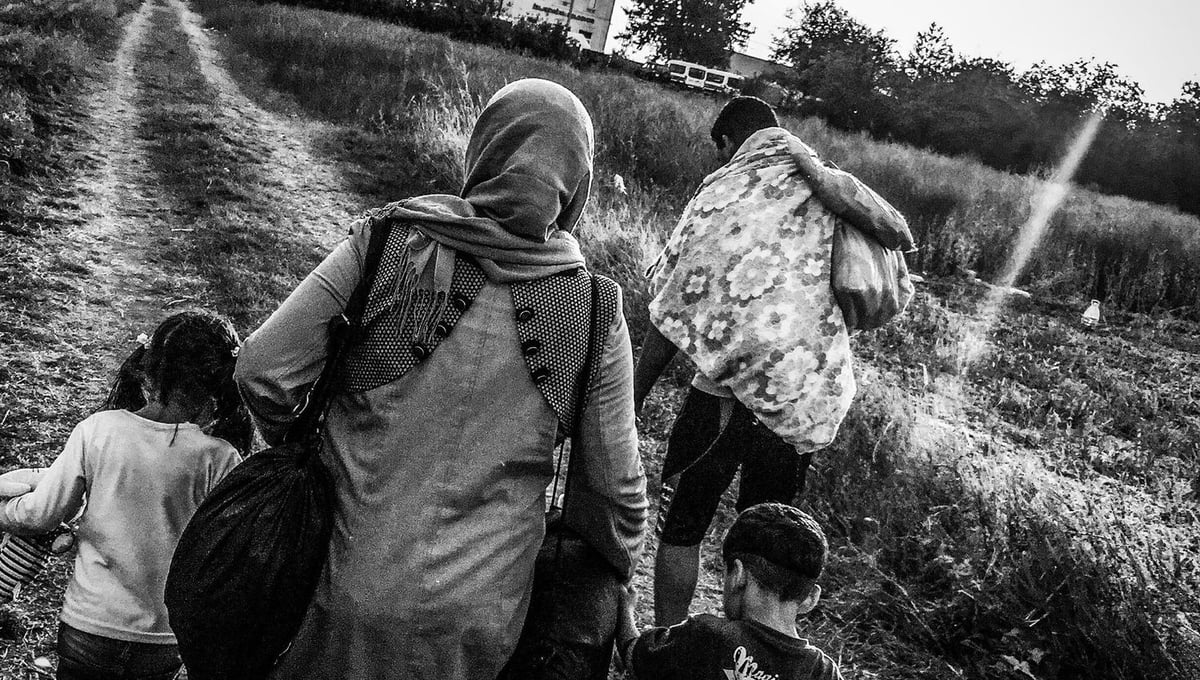 A Syrian refugee family arrives into Croatia from Serbia, hoping to board the train in Tovarnik.