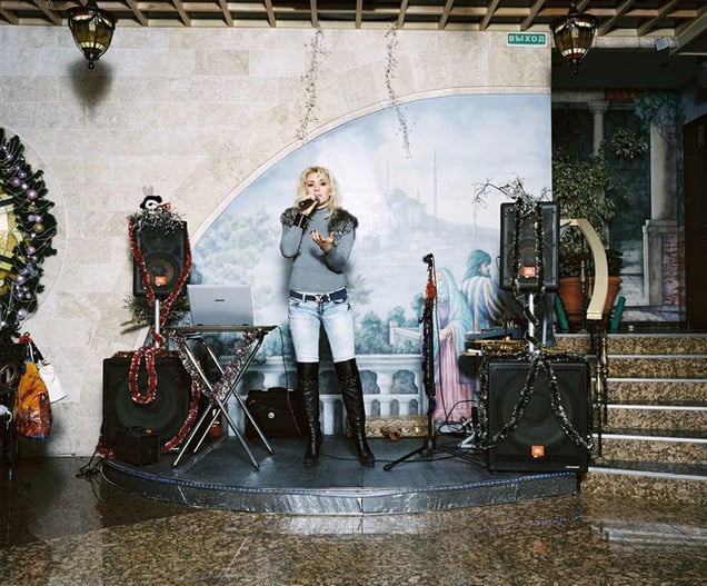 1st prize Arts and Entertainment Stories © Rob Hornstra, The Netherlands. The Sochi Project: Sochi Singers. Marika Bajur sings "Kuriu" in the restaurant Eurasia. The southern Russian city of Sochi lies on the Black Sea and attracts predominantly Russian holidaymakers who come for a mix of sun, sea, sand and nightlife.